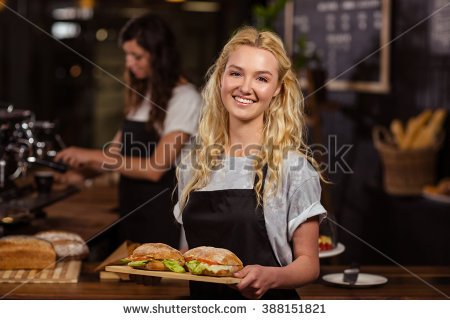 stock-photo-pretty-waitress-holding-a-tray-with-sandwiches-at-the-coffee-shop-388151821.jpg